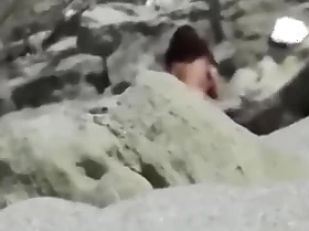 Spied on with an increment of filmed a concupiscent random couple fucking on the beach