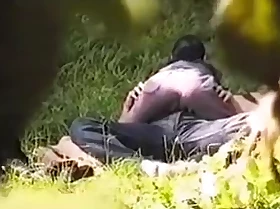 Spying on a oddball young couple having sex in the park