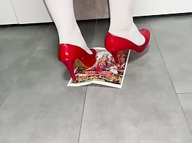 Dame stomping on picture in high heels, stepping on paper in heels, crushing trampling in heels