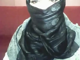Bored arab cutie wide hijab plays on her calculator
