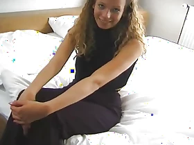 cute piece of baggage lolls on a catch bed and shows her willing cunt