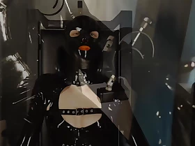 Rubberslut with Big Rubber Helmet fucking will not hear of pussy on slave chair