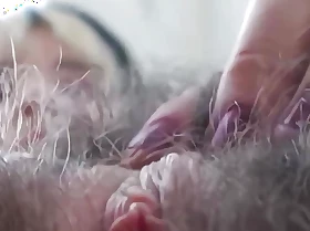 Super Hairy 'round Over Girl Plays with Pussy