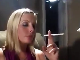 Hot blonde lassie lights a cigarette and smokes so seductively